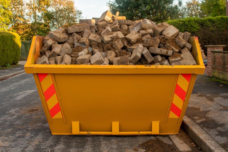 Yellow skip full of construction waste