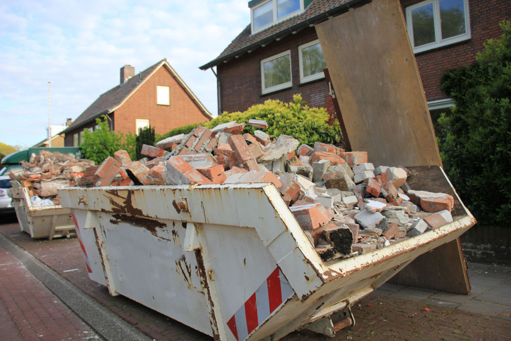 White industrial Skip hire Filled With Bricks